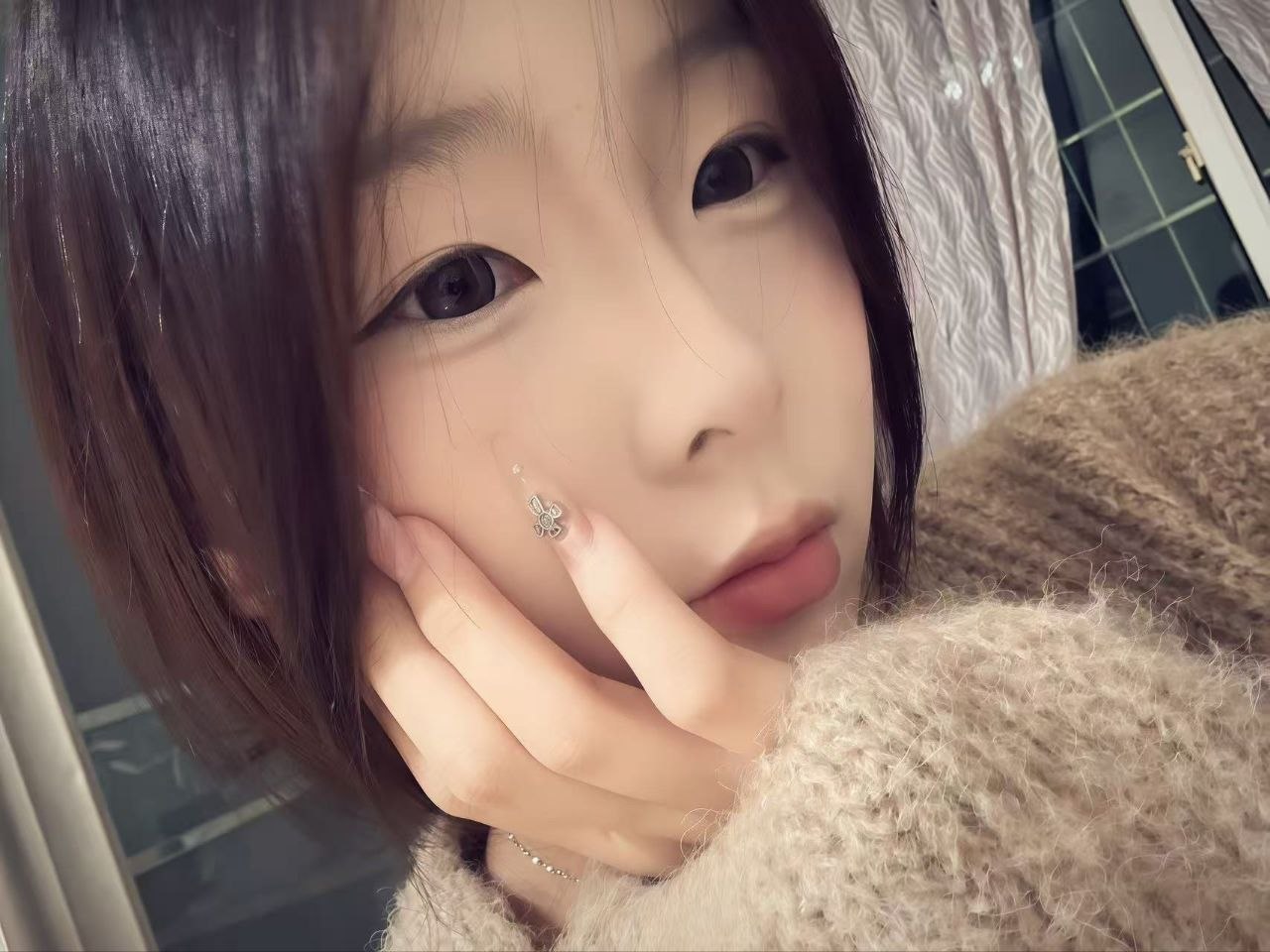 七七